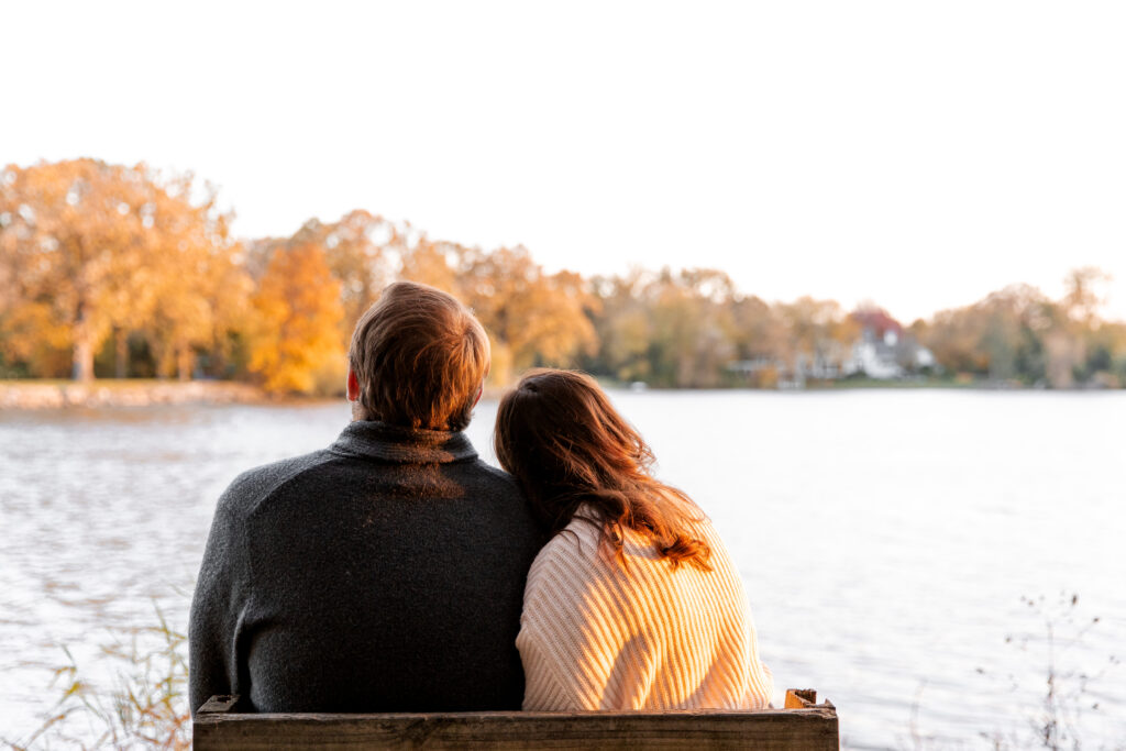 anniversary photo of couple on bench looking at water in northern Illinois suburbs