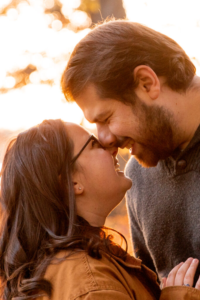 portrait of man and woman kissing during fall photo session